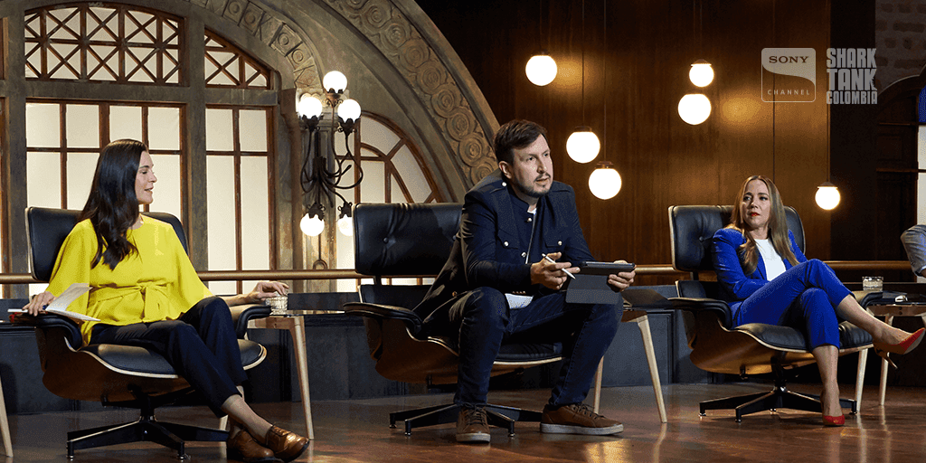 Executive conversation on an interview set.