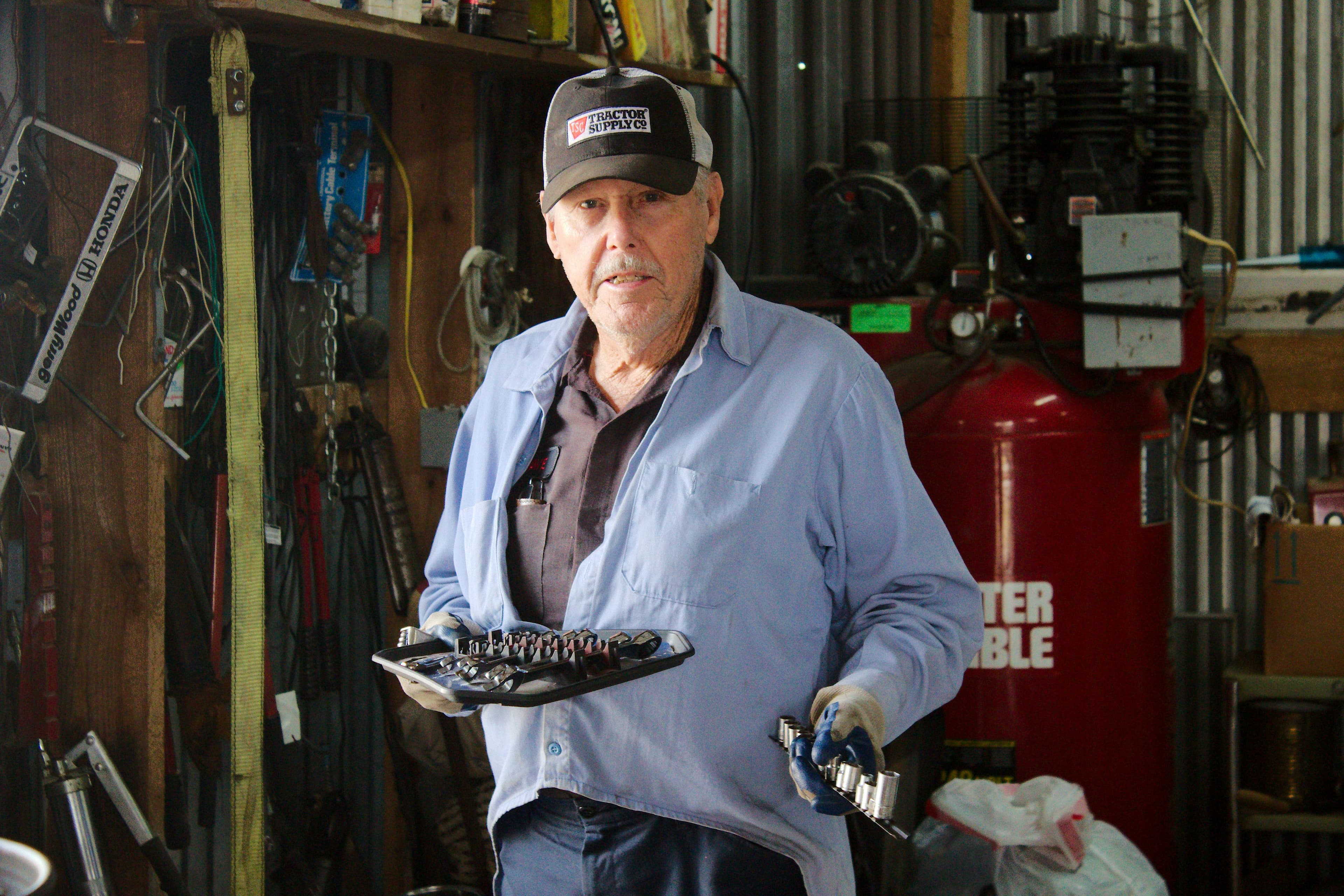 Repair shop technician working with tools.